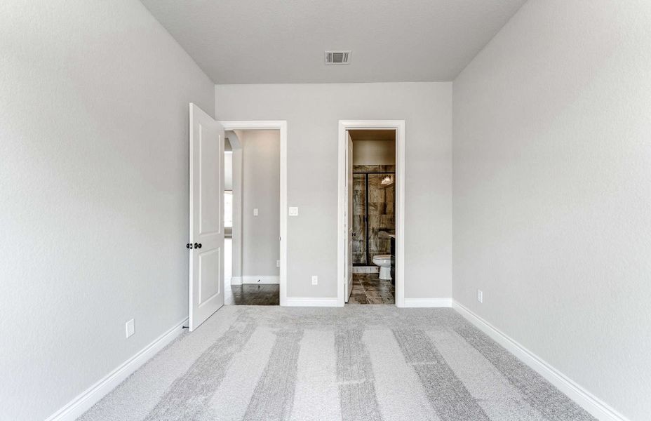 Representative unfurnished interior of a home built from the 3799 by Ravenna Homes in Artavia 70′, Conroe (Image 48).