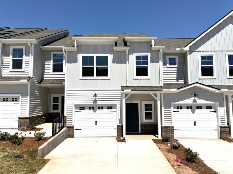Front exterior of a new home in Holly Ridge, Greenville, SC, highlighting curb appeal (Image 1).