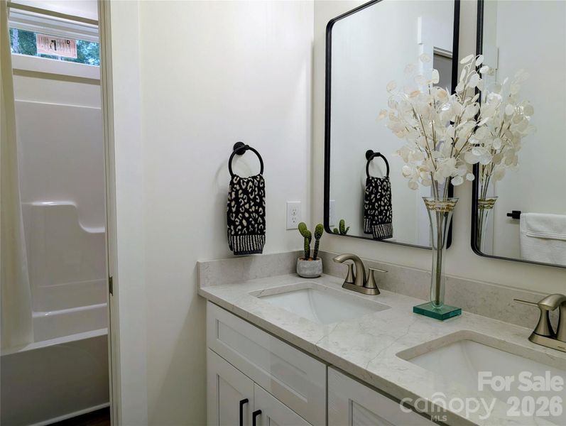 Bedrooms-shared bath cabinet and sinks; tub/shower combo and toilet are farther in. Bedrooms-shared bath cabinet and sinks; tub/shower combo and toilet are farther in.