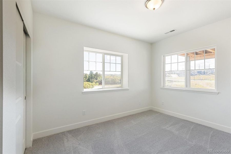 Spacious, unfurnished interior of a new home in Terrain Oak Valley, Castle Rock (Image 30).