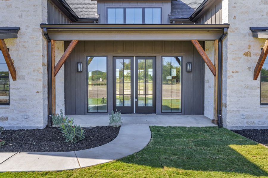 Front exterior of a new home in Oak Water Ranch, Granbury, TX, highlighting curb appeal (Image 27).