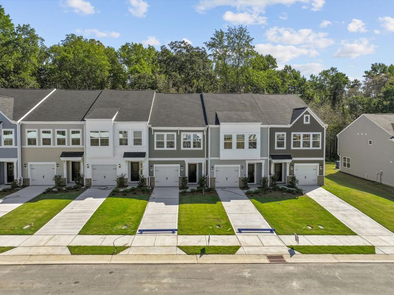 Front exterior of a new home in West Main Townhomes, Sanford, NC, highlighting curb appeal (Image 18).