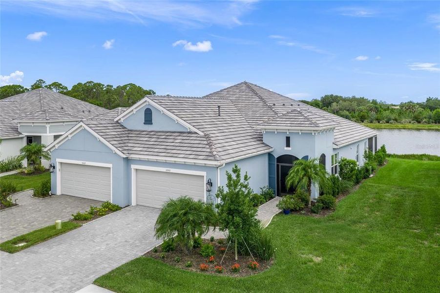 Front exterior of a new home in , Sarasota, FL, highlighting curb appeal (Image 1). Front exterior of a new home in , Sarasota, FL, highlighting curb appeal (Image 1).
