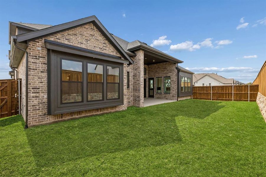 Your dream home features a private, fenced back yard and oversized covered back patio where the entire family can enjoy the great outdoors!