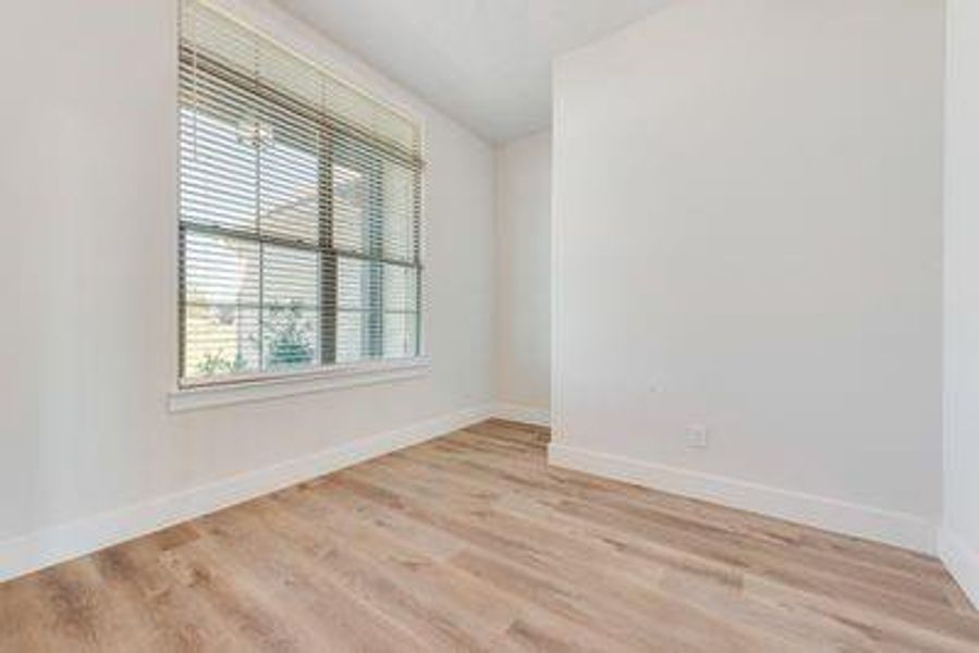 Unfurnished room with light hardwood / wood-style flooring