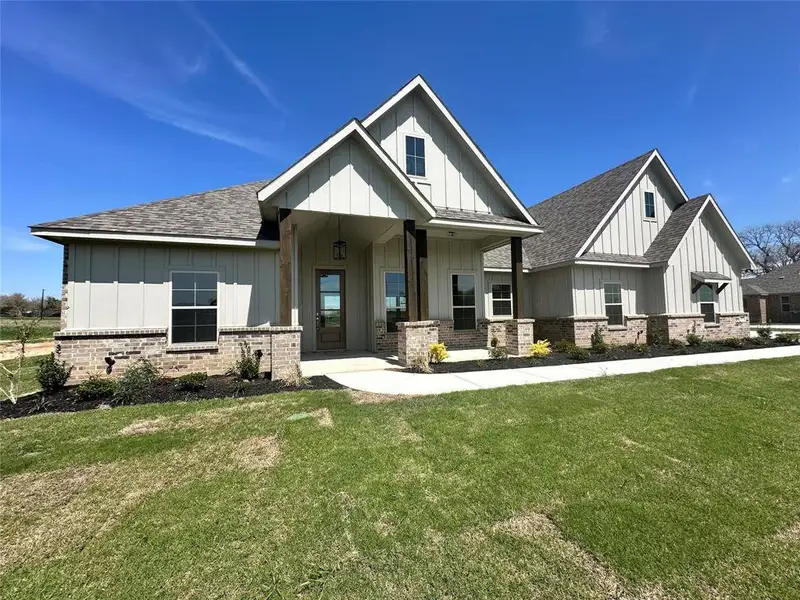Front exterior of a new home in , Decatur, TX, highlighting curb appeal (Image 15). Front exterior of a new home in , Decatur, TX, highlighting curb appeal (Image 15).