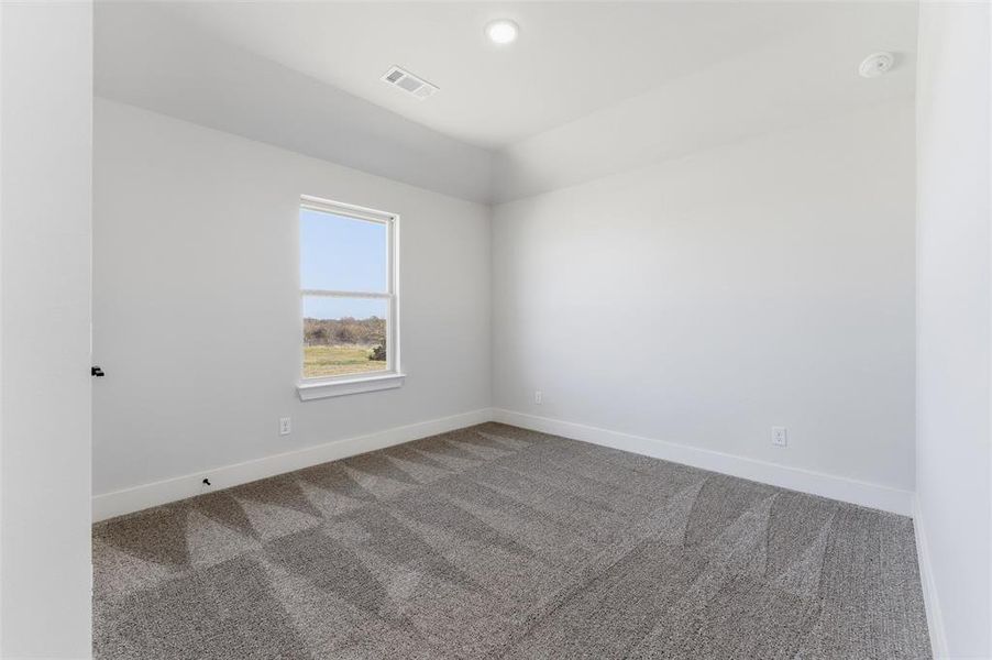 Unfurnished room with carpet flooring and recessed lighting