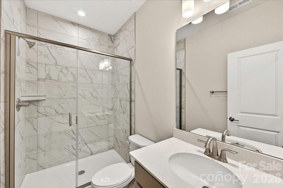 First floor full bathroom with tiled walk-in shower First floor full bathroom with tiled walk-in shower