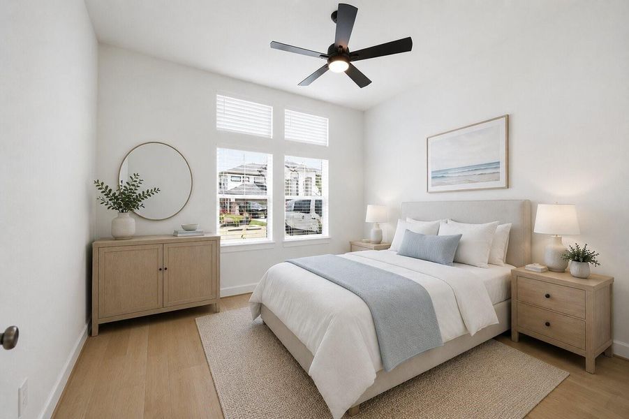 **Virtually Staged** Bright and spacious secondary bedroom with soaring ceilings, abundant natural light, warm wood flooring, and a serene neutral palette.