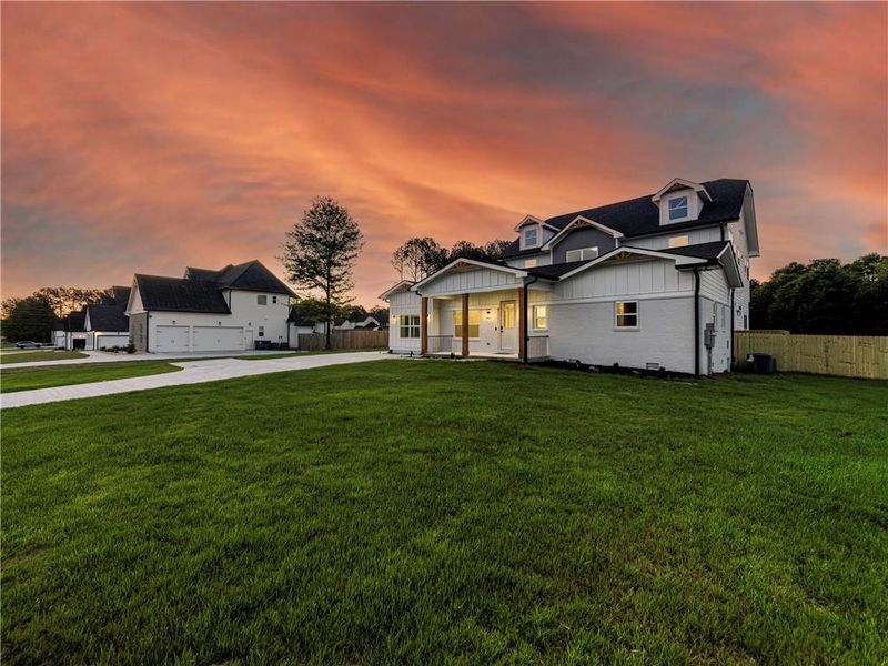 Front exterior of a new home in , Loganville, GA, highlighting curb appeal (Image 26).