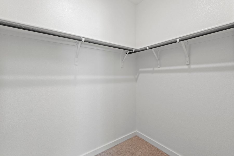 Walk-in Closet in the Pearl home plan by Trophy Signature Homes – REPRESENTATIVE PHOTO
