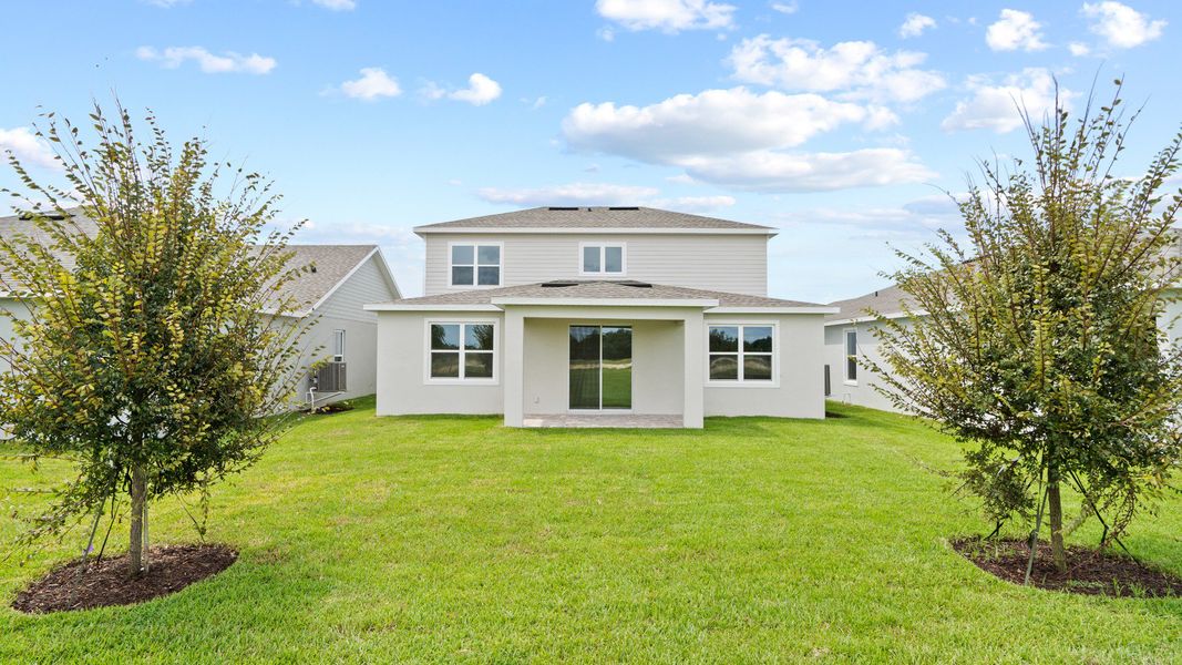 Mangrove Rear Exterior by DRB Homes, New Homes in Saint Cloud, FL at Lakeside at Satilla