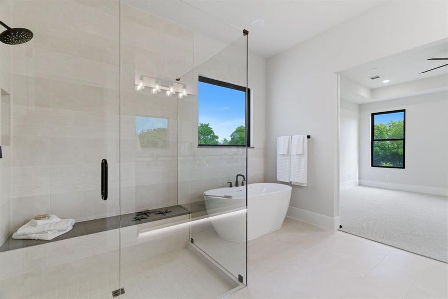 Frameless Glass Shower, Custom Tile with Bench Seat and Freestanding Soaking Tub for your Own Spa Bath.