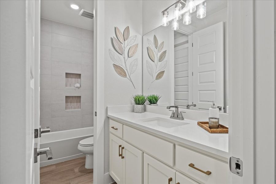 Representative furnished interior of a home built from the Bradley by Chesmar Homes in Sweetwater, Austin (Image 14).