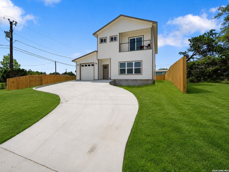 Front exterior of a new home in , Canyon Lake, TX, highlighting curb appeal (Image 2). Front exterior of a new home in , Canyon Lake, TX, highlighting curb appeal (Image 2).