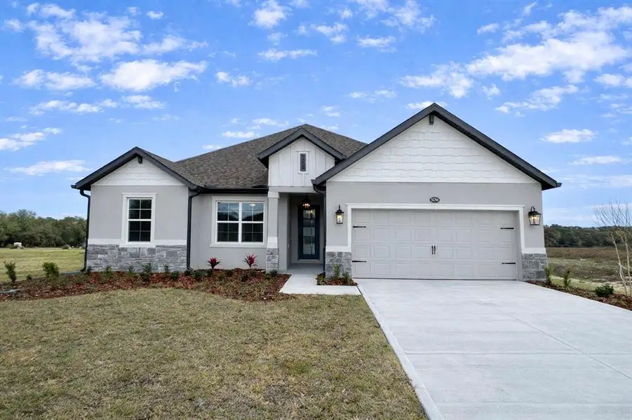 Front exterior of a new home in , Fruitland Park, FL, highlighting curb appeal (Image 2). Front exterior of a new home in , Fruitland Park, FL, highlighting curb appeal (Image 2).