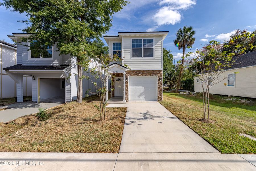 Front exterior of a new home in , Jacksonville, FL, highlighting curb appeal (Image 1). Front exterior of a new home in , Jacksonville, FL, highlighting curb appeal (Image 1).