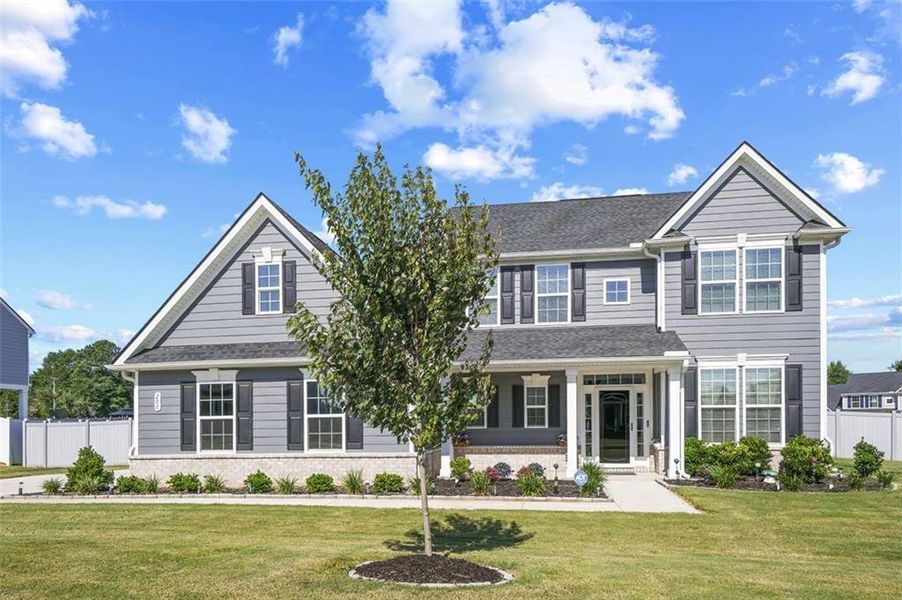 Front exterior of a new home in , Locust Grove, GA, highlighting curb appeal (Image 21).
