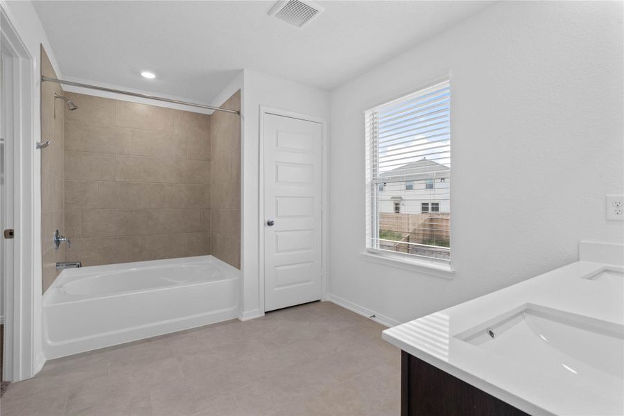 Furnished interior view inside a new home in Oakwood Trails, Tomball (Image 9).