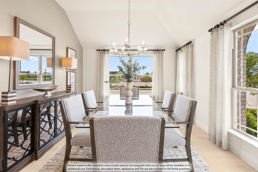 Formal dining room with glass table, upholstered chairs, chandelier, and vaulted ceiling with large windows