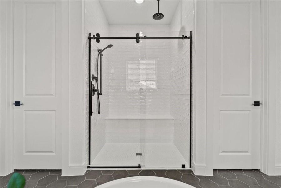 Primary walk-in shower.