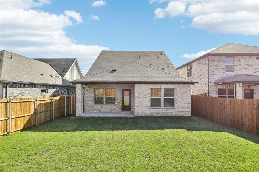Exterior details and patio area of a home in Simpson Crossing - Spring Series, McKinney (Image 2). Exterior details and patio area of a home in Simpson Crossing - Spring Series, McKinney (Image 2).