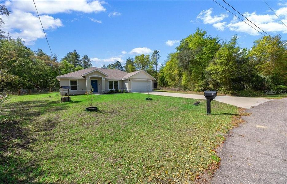 Front exterior of a new home in , Ocklawaha, FL, highlighting curb appeal (Image 20). Front exterior of a new home in , Ocklawaha, FL, highlighting curb appeal (Image 20).