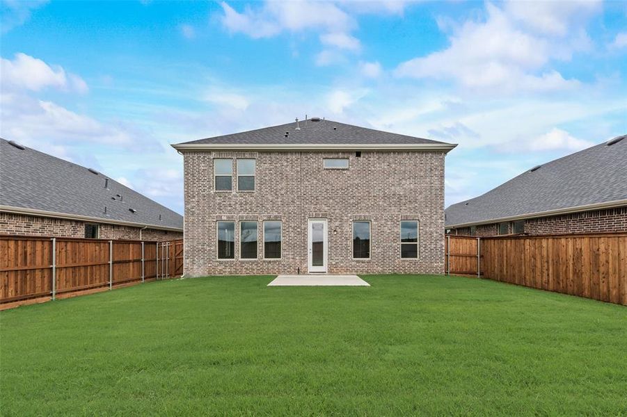 Front exterior of a new home in Spiritas Ranch, Little Elm, TX, highlighting curb appeal (Image 17). Front exterior of a new home in Spiritas Ranch, Little Elm, TX, highlighting curb appeal (Image 17).