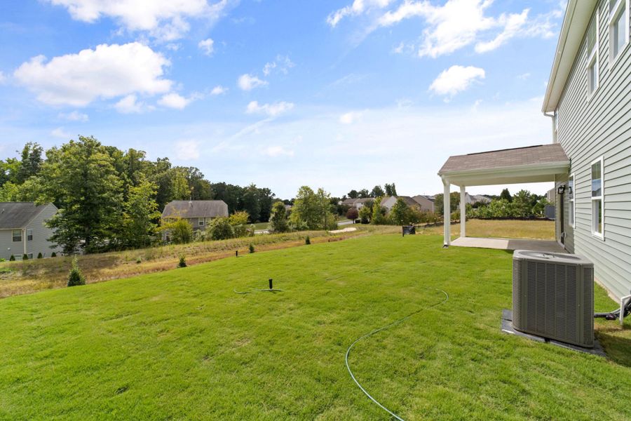 Exterior details and patio area of a home in Chandler Ridge, McLeansville (Image 2).
