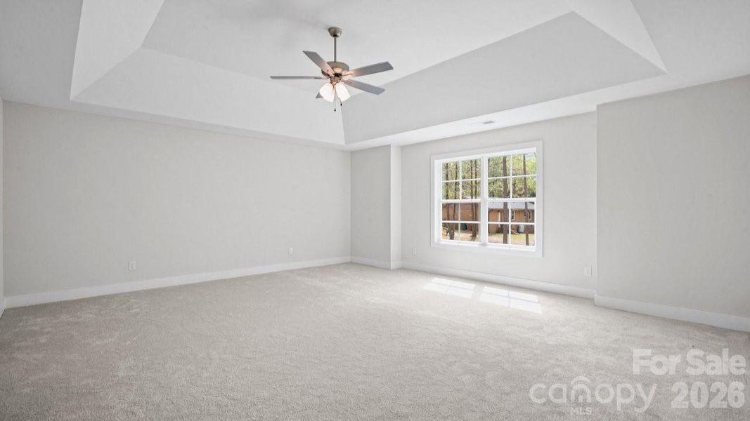 Primary Bedroom with High Ceiling.