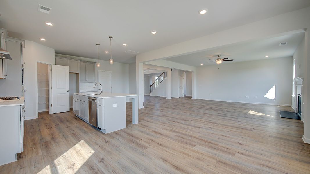 McKinley II breakfast area connected to kitchen with natural light and open layout at Brighton in Locust Grove, GA.