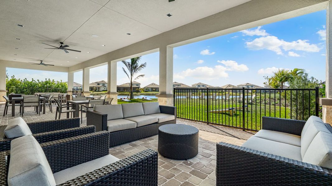 Exterior details and patio area of a home in Esplanade by the Islands, Naples (Image 3).