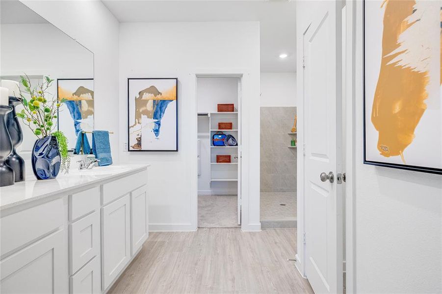 Hall featuring sink and light hardwood / wood-style flooring