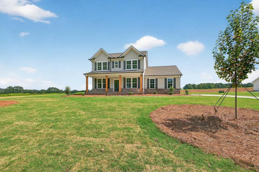 Front exterior of a new home in Magnolia Ridge, Monroe, GA, highlighting curb appeal (Image 25).