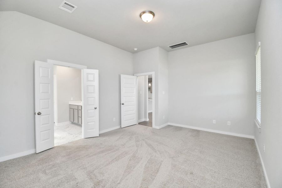 Come and unwind after a long day in this magnificent primary suite! This spacious room features plush carpet, warm paint, high ceilings and large windows with privacy blinds. Come and unwind after a long day in this magnificent primary suite! This spacious room features plush carpet, warm paint, high ceilings and large windows with privacy blinds.