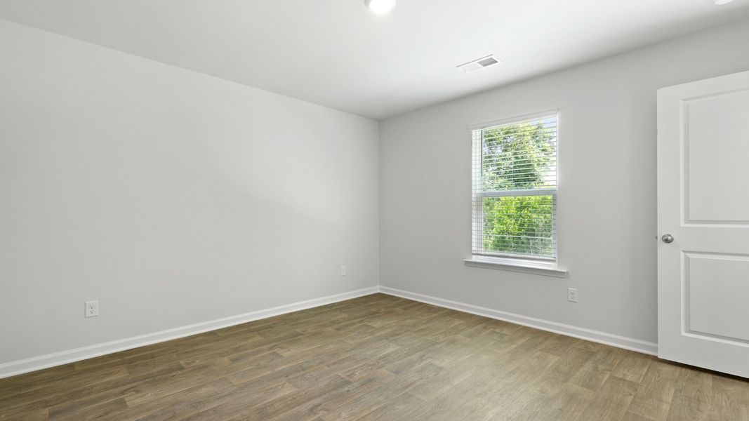 Spacious, unfurnished interior of a new home in Pine Hills at Cane Bay, Summerville (Image 19).
