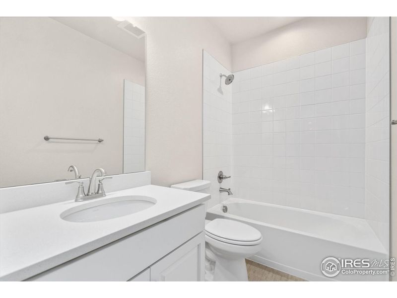 Full Bath in Basement with White Sand Quartz Countertops!