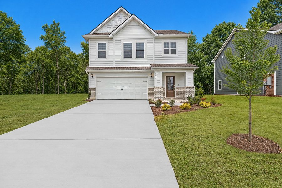 Front exterior of a new home in Farmhouse Downs, Murfreesboro, TN, highlighting curb appeal (Image 1). Front exterior of a new home in Farmhouse Downs, Murfreesboro, TN, highlighting curb appeal (Image 1).