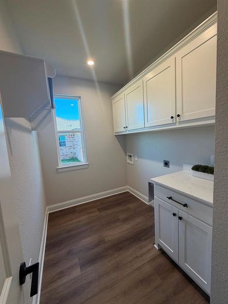 Laundry area featuring washer hookup, dark wood-style flooring, electric dryer hookup, cabinet space, and recessed lighting