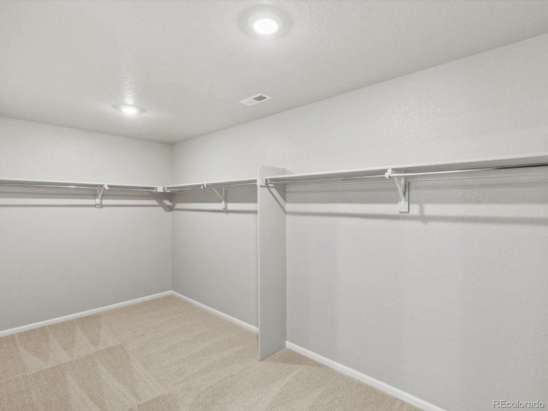 Spacious, unfurnished interior of a new home in Ridgeline Vista: The Flora Collection, Brighton (Image 18). Spacious, unfurnished interior of a new home in Ridgeline Vista: The Flora Collection, Brighton (Image 18).