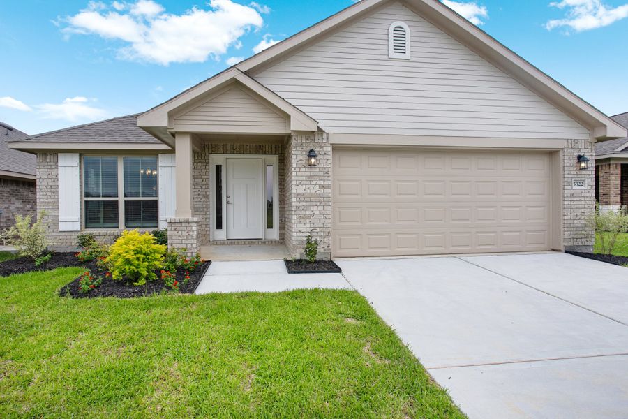 Front exterior of a new home in Bayou Maison, Dickinson, TX, highlighting curb appeal (Image 2).