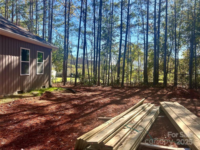 Back yard, surrounded by trees for privacy, neighbors that border to rear have fence