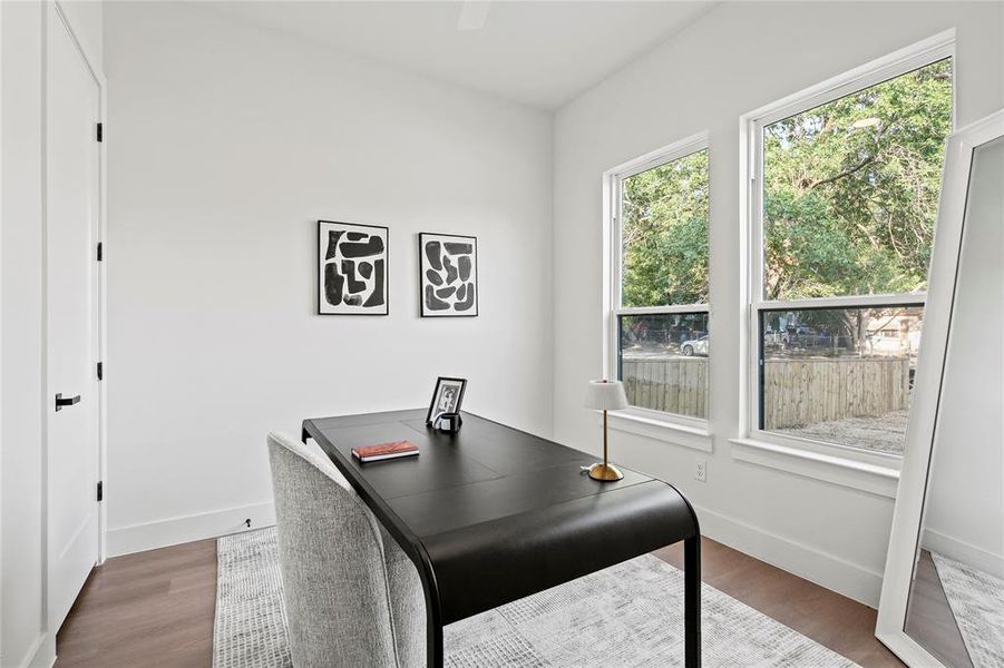 Home office with wood finished floors