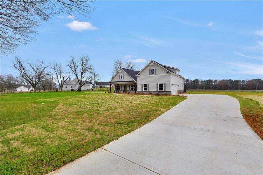 Front exterior of a new home in , McDonough, GA, highlighting curb appeal (Image 20).