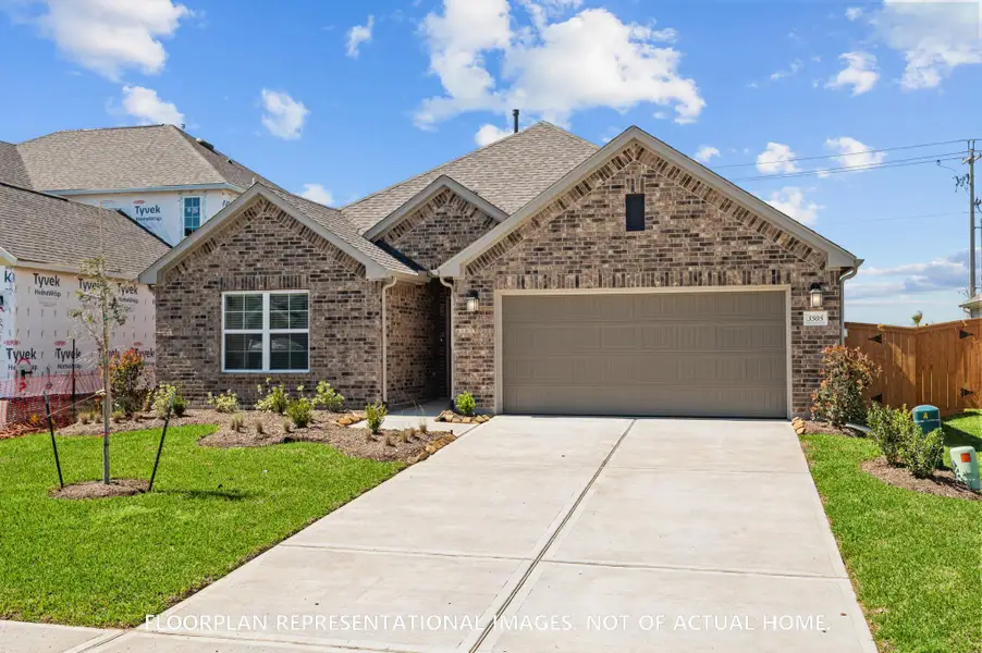 Front exterior of a new home in Lone Star Landing, Montgomery, TX, highlighting curb appeal (Image 1). Front exterior of a new home in Lone Star Landing, Montgomery, TX, highlighting curb appeal (Image 1).