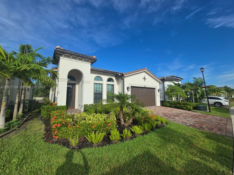 Front exterior of a new home in , Parkland, FL, highlighting curb appeal (Image 1). Front exterior of a new home in , Parkland, FL, highlighting curb appeal (Image 1).