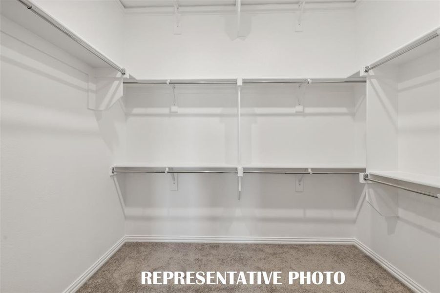 A dream owner's closet with seasonal hanging space is the cherry on top in this dreamy owner's suite! REPRESENTATIVE PHOTO A dream owner's closet with seasonal hanging space is the cherry on top in this dreamy owner's suite! REPRESENTATIVE PHOTO