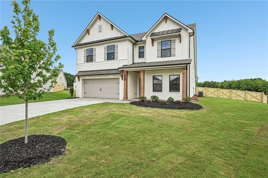 Front exterior of a new home in Pinecrest Ridge, Dacula, GA, highlighting curb appeal (Image 29). Front exterior of a new home in Pinecrest Ridge, Dacula, GA, highlighting curb appeal (Image 29).