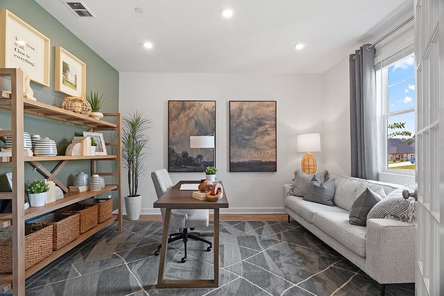 A living room with a couch and a coffee table. A living room with a couch and a coffee table.