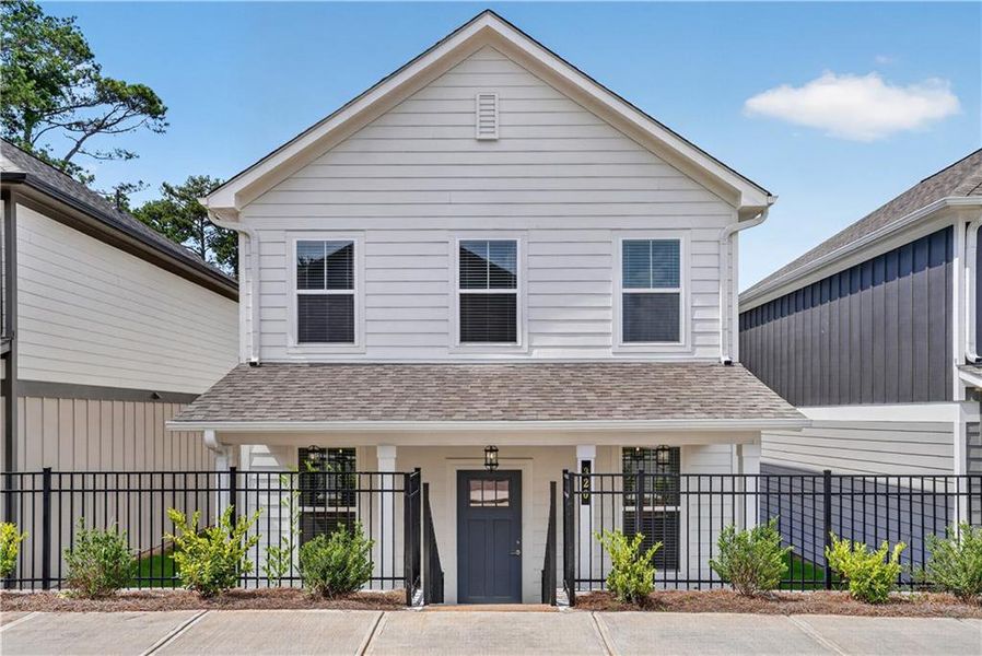 Front exterior of a new home in The Cottages at East Lanier, Fayetteville, GA, highlighting curb appeal (Image 16).
